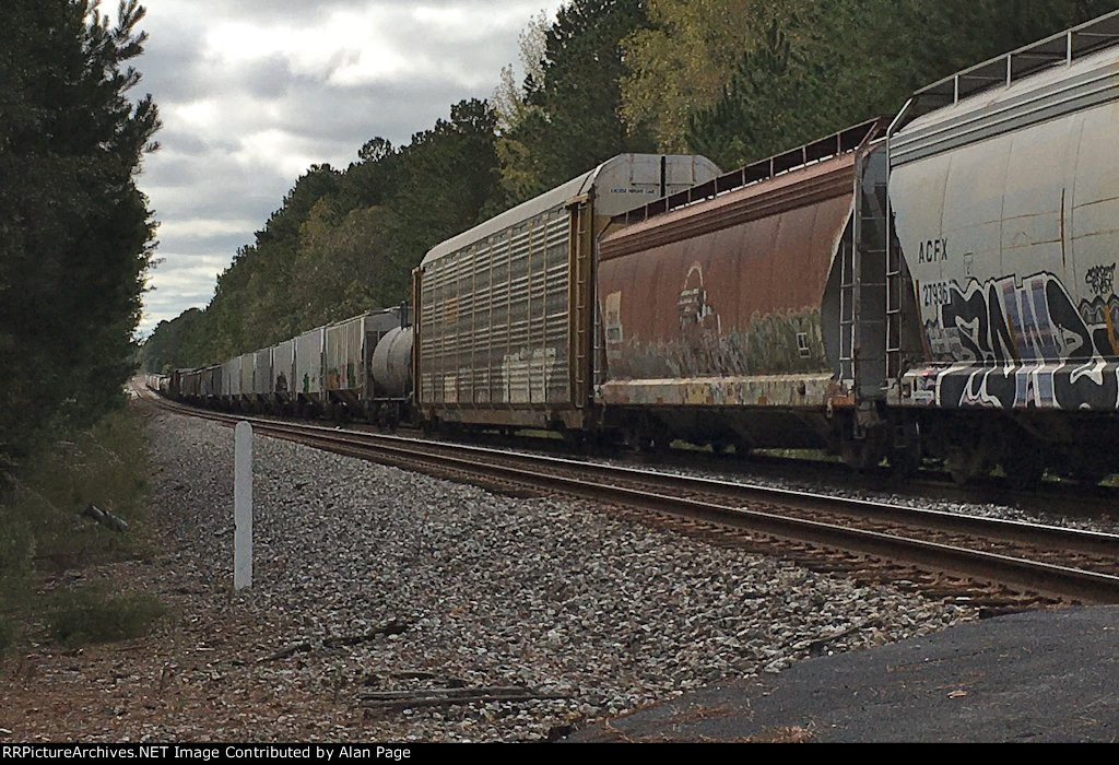 CSX 3150 leads a line of mixed freight